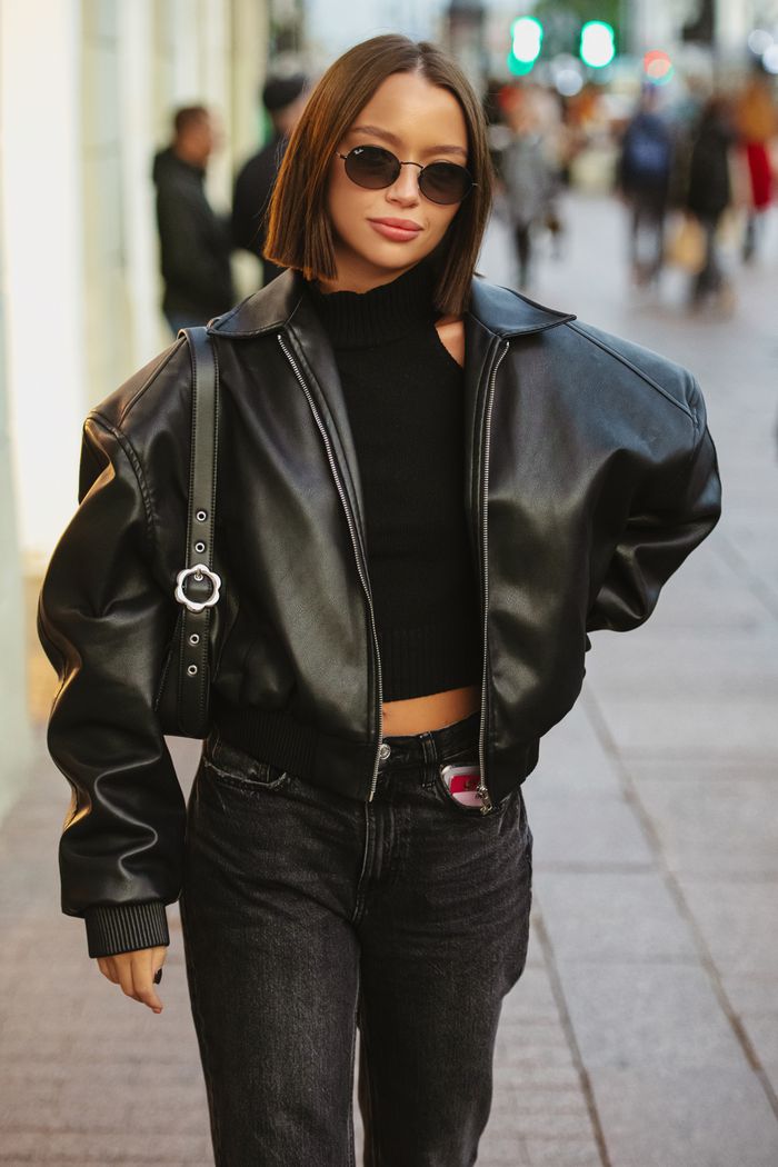 The Art of Drawing Readers In: Your attractive post title goes here Stylish woman in leather jacket struts confidently along bustling urban street.